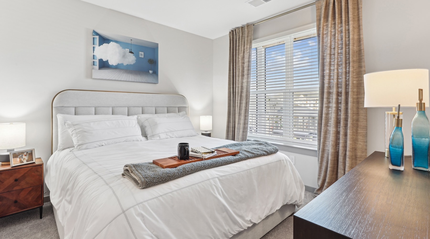 a bedroom with a bed and two nightstands
