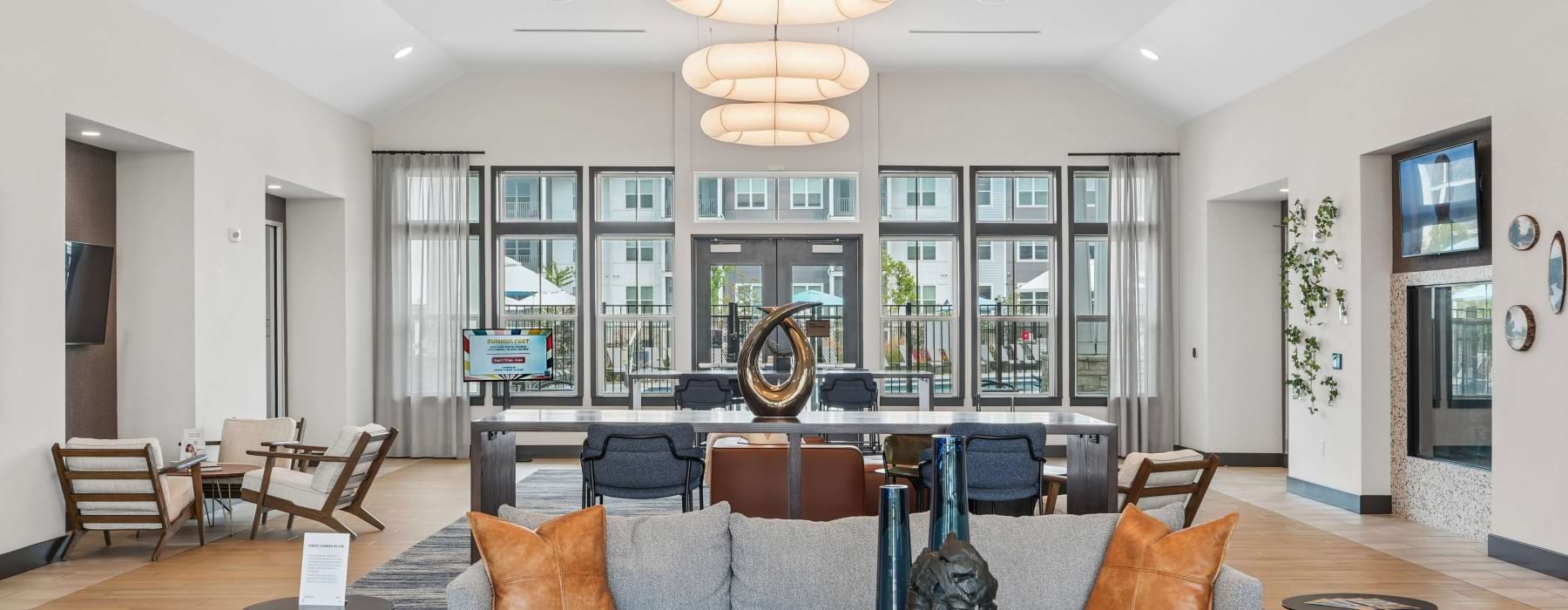 Interior of leasing office with sculpture at Alta Cosner apartments for rent in Fredericksburg, VA.	